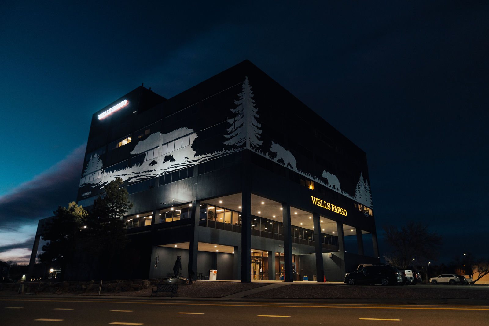 Bear Valley Center exterior glowing at night under the Denver sky