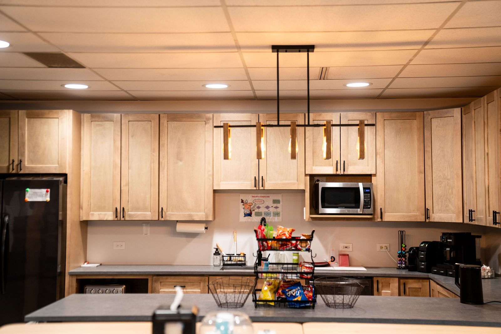 Shared kitchen with pendant lighting and cabinetry at Bear Valley Center